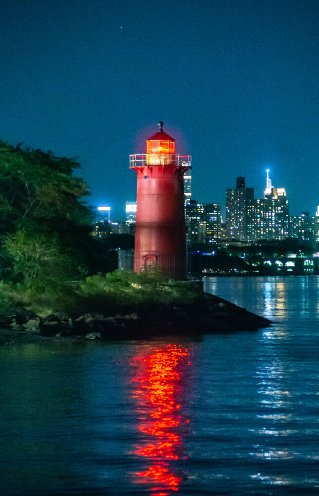 Jeffrey's Hook, The Little Red Lighthouse, at night with NYC in background