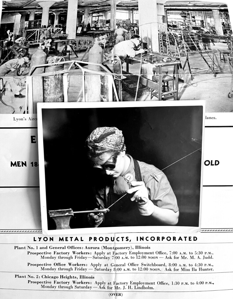 Black and white photo of woman with bandana holding back her hair while welding